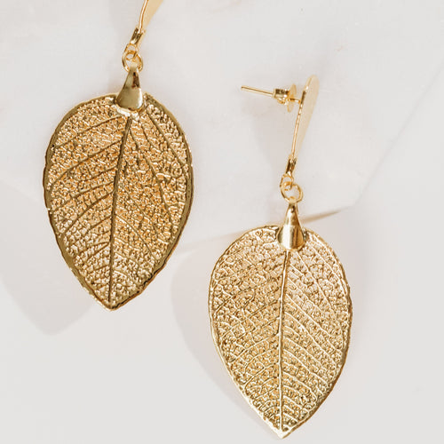 plant dangling gold earrings Sheinelle Jones earrings TODAY SHOW botanical earrings made from real plants cerrado botanical jewelry 