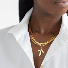 Load image into Gallery viewer, gold arruda grace herb leaf necklace cotton cords vegan
